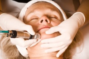 older woman getting electrolysis on he face